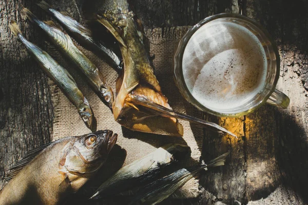 Glass of beer with dried fish — Stock Photo, Image