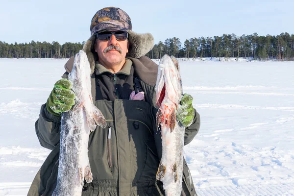 Man holding catch winter fishing pike fish — Stock Photo, Image