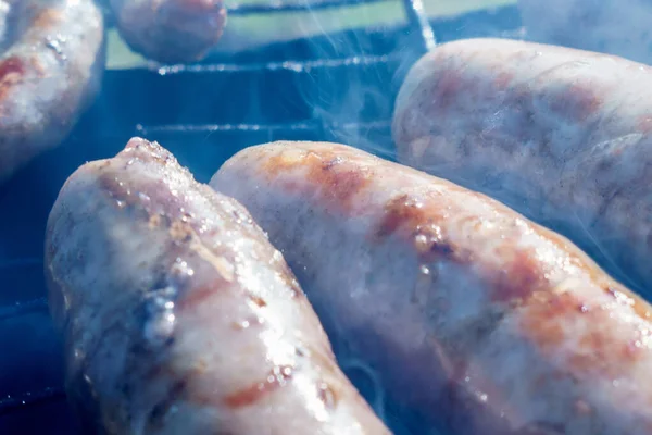 Grilled sausages on the grill close up — Stock Photo, Image
