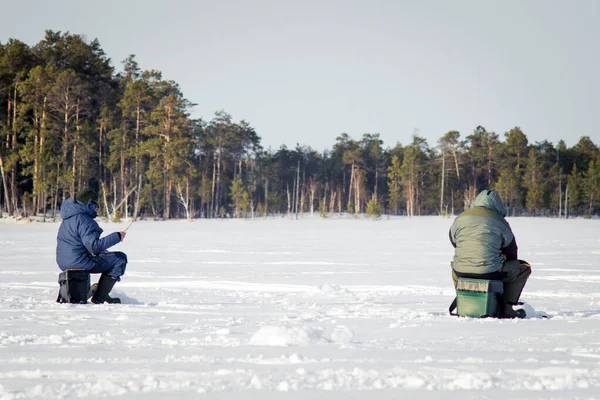 Fishermen in the winter for ice fishing — Stock Photo, Image