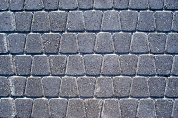 Textur einer Kopfsteinpflasterstraße, Hintergrund — Stockfoto