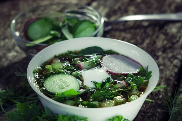 traditional Russian dish okroshka, soup in rustic style