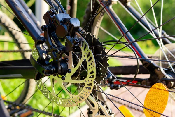 Bicycle wheel: disc brakes, spokes. Cycling, Bicycle repair adjustment of brakes