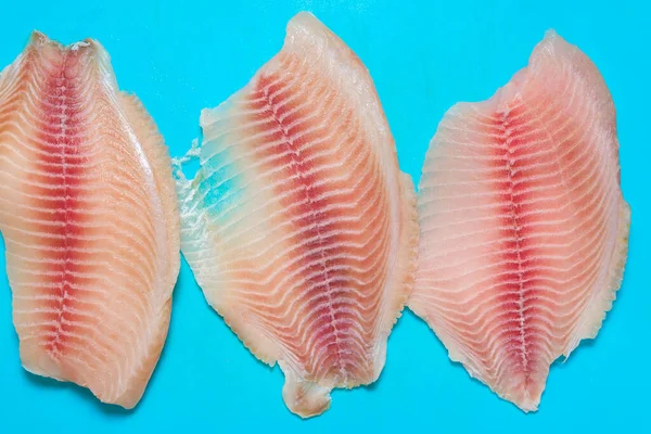 Whitefish Tilapia Fish Raw Fillet. Selective focus. To close. top view, contains omega 6 and omega 3