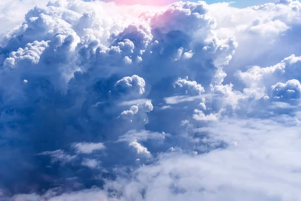 White clouds in blue sky. Aerial bird\'s eye clouds. Aerial top cloudscape. Texture of clouds. View from above.