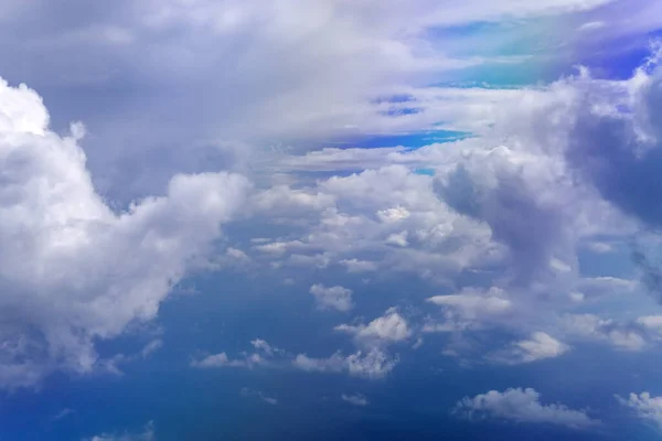 White clouds in blue sky. Aerial bird\'s eye clouds. Aerial top cloudscape. Texture of clouds. View from above.