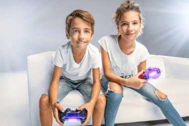 Two kids play video game clipart