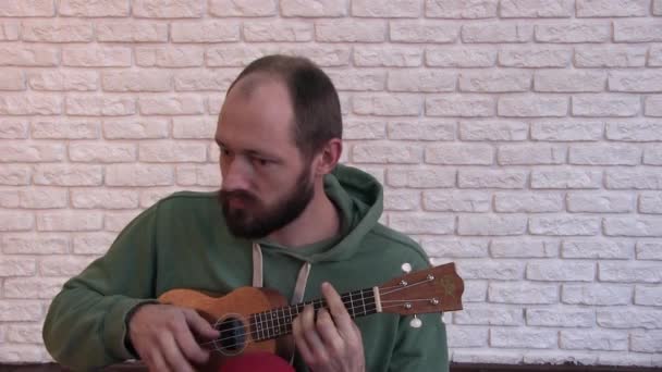 Portrait One Young Man Who Sits Front Camera Plays Ukulele — Stock Video