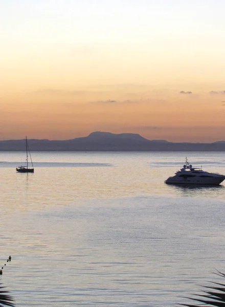 Summer sea sunrise, the sky and sea with yacht, beautiful lighting. Amazing landscape