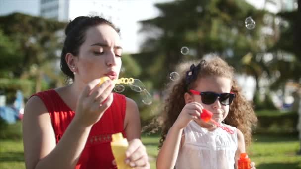 Happy Child Blowing Soap Bubbles Park Beautiful Curly Hair Little — Stock Video