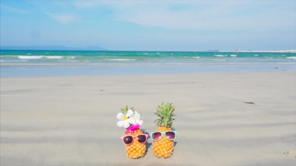 On a Tropical Beach Close-Up of Under the Hot Summer Sun Along the Tropical Exotic Coast standing on sand tropical fruits. Concept Summer Background. — Stock Video