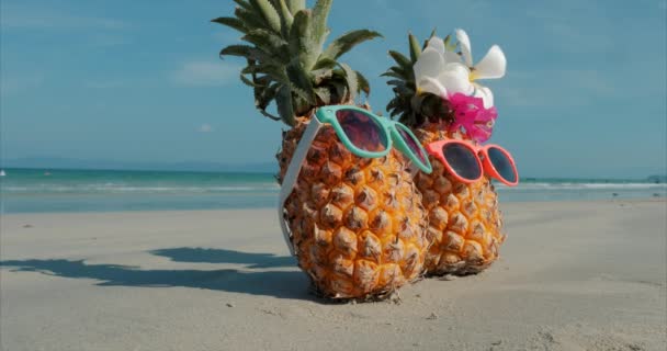 On a Tropical Beach Close-Up of Under the Hot Summer Sun Along the Tropical Exotic Coast standing on sand tropical fruits. Concept Summer Background. — Stock Video