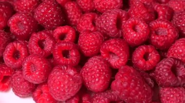 Yakın Rotasyon Loopable Ahududu. Taze, Sulu Ahududu Arka Plan, Olgun. Makro Kırmızı Ahududu Meyve. Gıda Dackground olarak Taze Ahududu Meyveler. Sağlıklı Gıda Organik Beslenme.