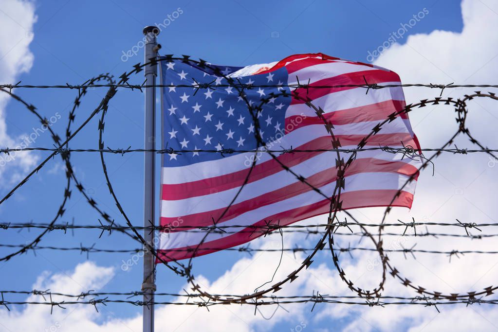 USA Border with American Flag and barbed Wire