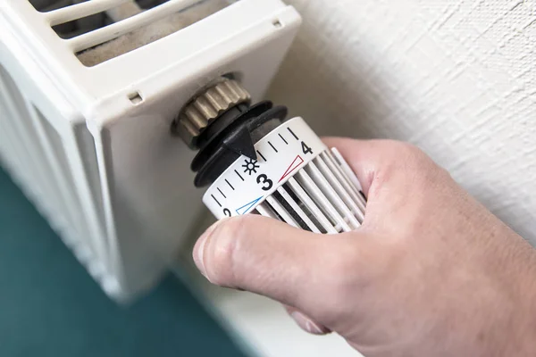 Close-up central heating system with Arm of a Man