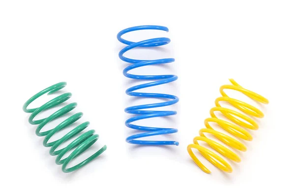 Brinquedo Mola Plástico Amarelo Verde Azul Espirais Isolados Fundo Branco — Fotografia de Stock