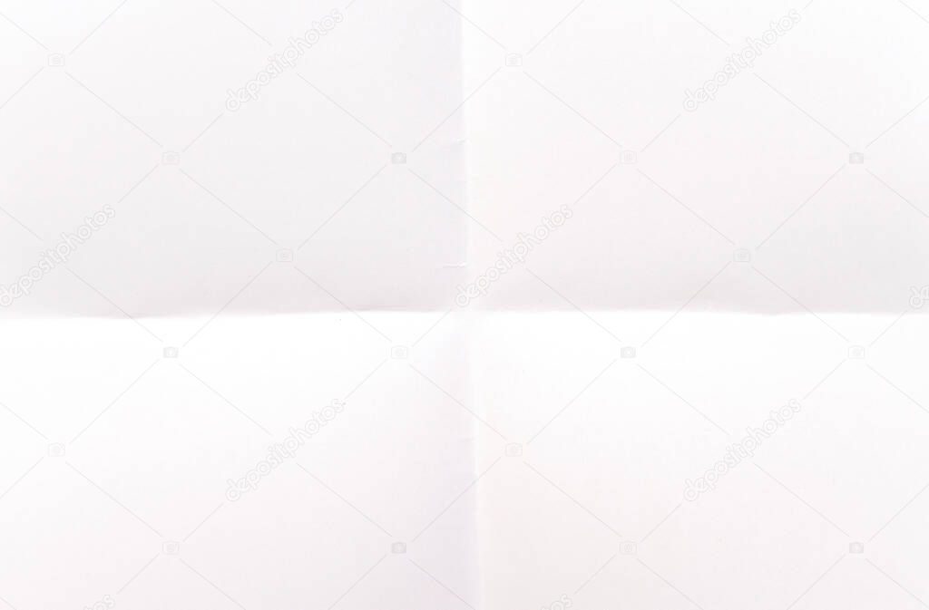 White folded paper as background or texture, top view, 