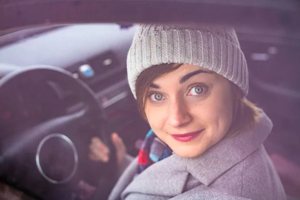 Woman driving a car.