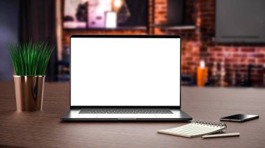 Laptop, defter, kalem ve akıllı telefon.
