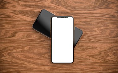 Boş ekranlı, ahşap arka planda izole edilmiş akıllı telefonlar.