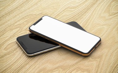 Boş ekranlı, ahşap arka planda izole edilmiş akıllı telefonlar.