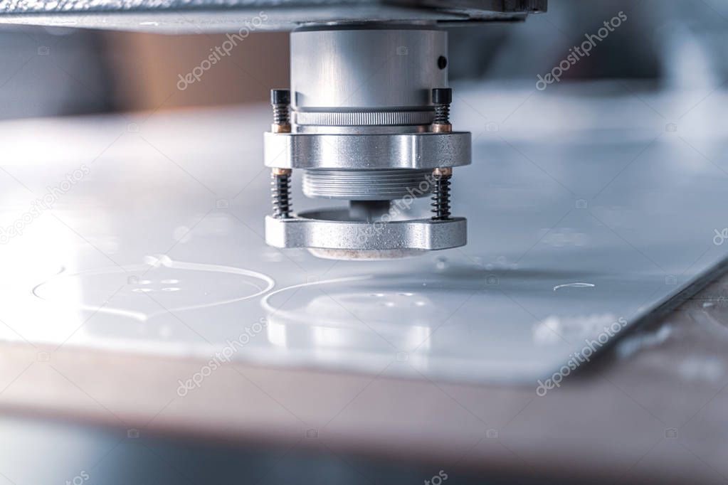 CNC machine cutting with a controlled knife.