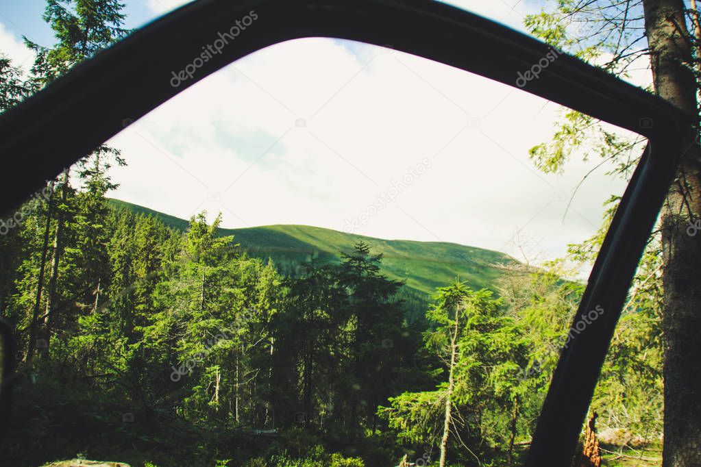 Offroad car rides through the mountains. Ukrainian Carpathian Mountains. Hills and mountain peaks. Fabulous look.
