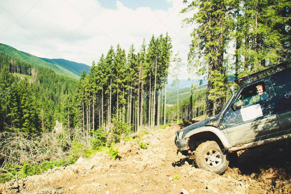 Offroad car rides through the mountains. Ukrainian Carpathian Mountains. Hills and mountain peaks. Fabulous look.