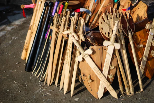 Toys and gifts for tourists in Kamyanets Podolsk. Souvenir production. Swords and shields. Bows for children. Wooden products. Wooden beats