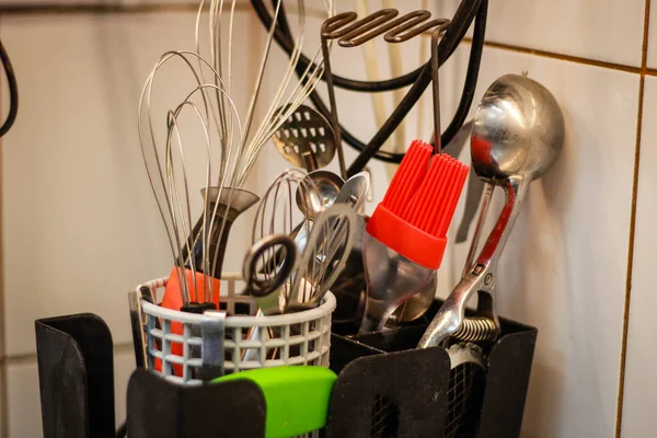 The kitchen tools are in a black box on the kitchen table.