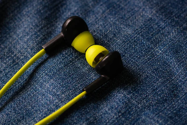 Headphones in the back pocket of jeans. Copy Space Background fo — Stock Photo, Image