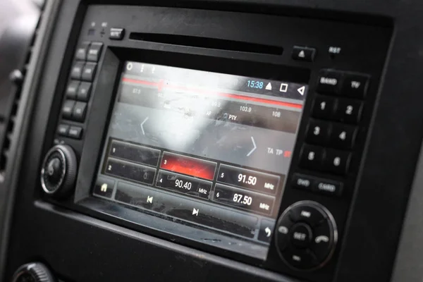 The tape recorder in the car. Music in the car and navigation. B — Stock Photo, Image