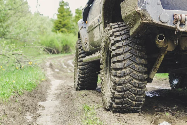 Dirty cars and wheels in the mountains. Swamp on the tires. Trip