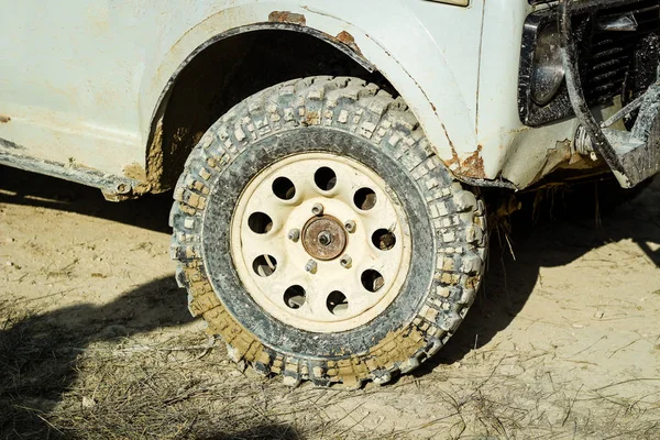 Off-road dirty car wheels. Swamp rubber. Jeep in the swamp. Tria