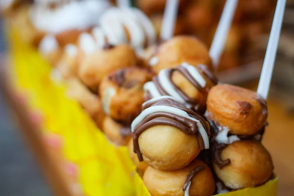 Mini donuts with chocolate. Street food in Bulgaria. Cookies in — Stock Photo, Image