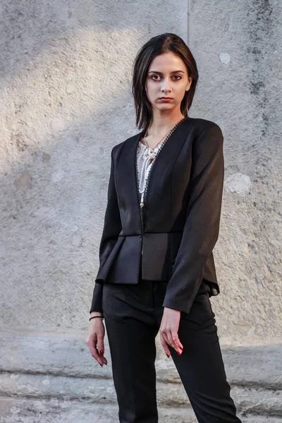 Black haired girl.Business woman in black classic suit.White blo — Stock Photo, Image