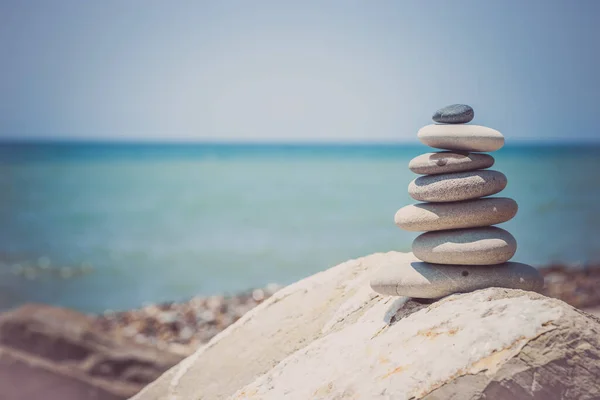 Stack of zen stones near sea. Harmony, balance