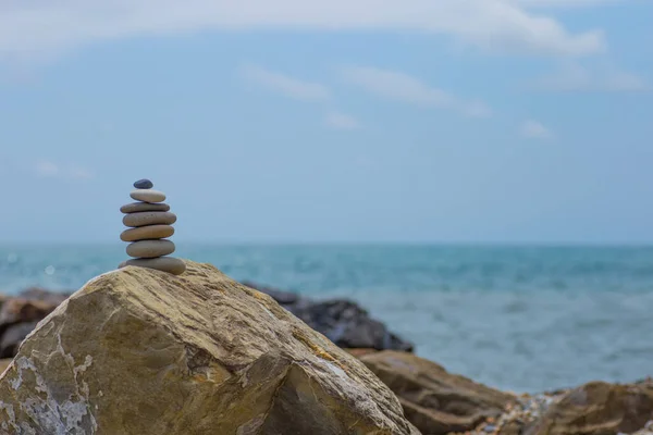 Stack of zen stones near sea. Harmony, balance