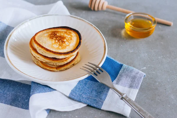 stock image Delicious pancakes with honey for breakfast