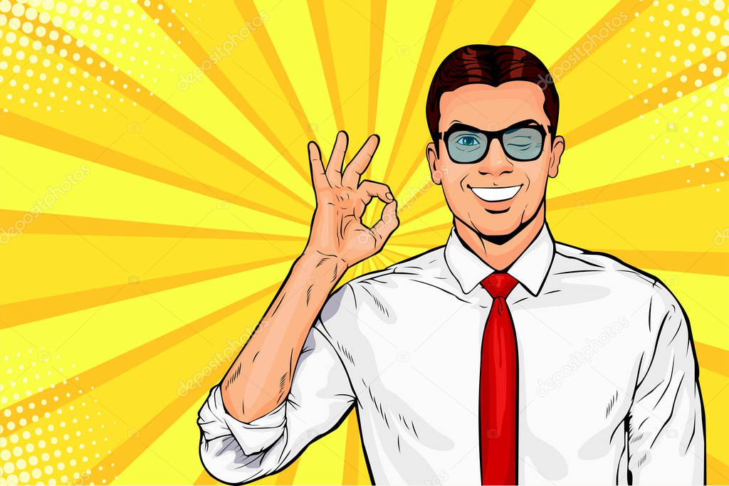 Male businessman in glasses winks and shows okay or OK gesture. Pop art retro vector illustration. Success concept. Invitation poster.