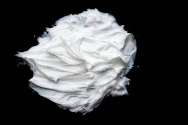 krem yakın çekim doku. Karalama siyah bir zemin üzerine krem