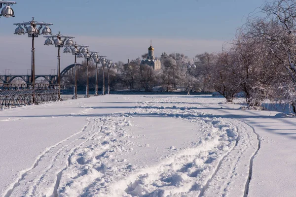 snow on the street. Street lights