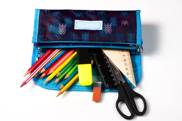 pencil case on a white background. pencils in the pencil case. ruler and scissors. school supplies