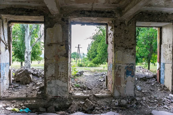 The old abandoned overgrown school building.