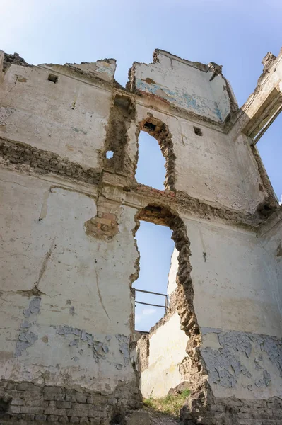 The old abandoned overgrown school building.