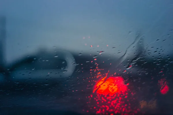 Raindrops on the car window in the night