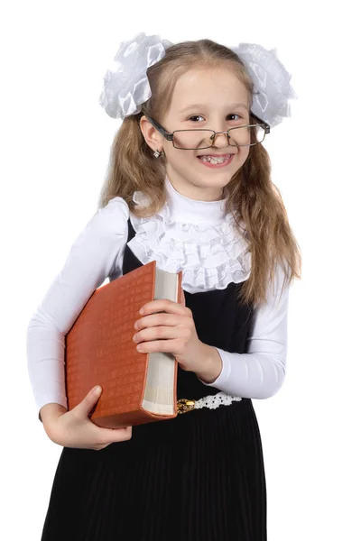 Little cute schoolgirl posing on a white background. — Stock Photo, Image