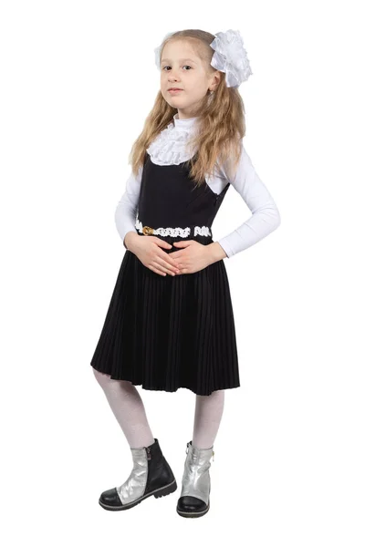 Little cute schoolgirl posing on a white background. — Stock Photo, Image