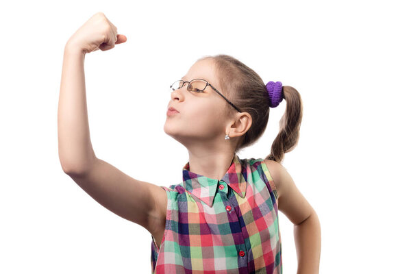Little cute girl in glasses posing on a white background. Child with poor vision