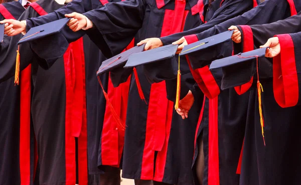 Graduate Students Hold Hats Hands University Graduation Success Ceremony Congratulation — Stock Photo, Image